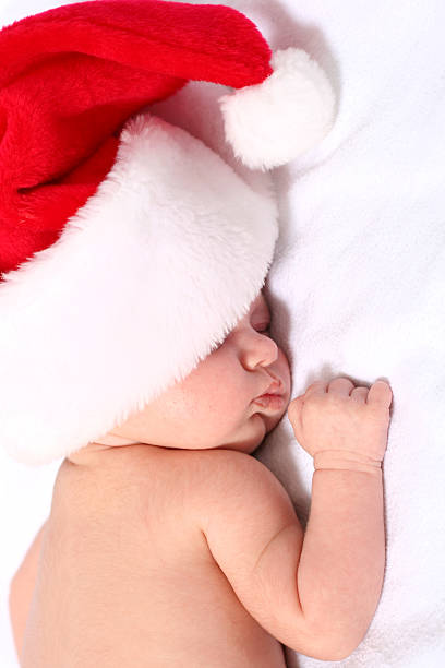 christmas Santa baby sleeping stock photo