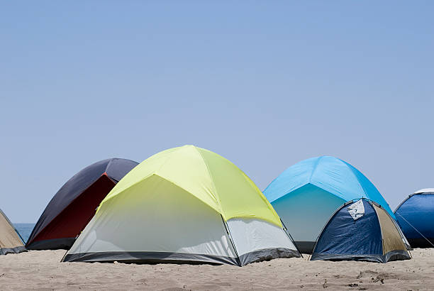 Camping at the beach Camping at the beach tienda stock pictures, royalty-free photos & images