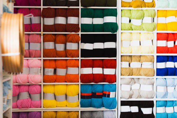 istock Shelves with colorful wool and yarn 893440488