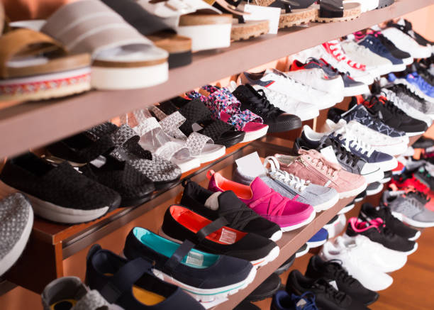 istock Stylish shoes are standing on shelves 893443670