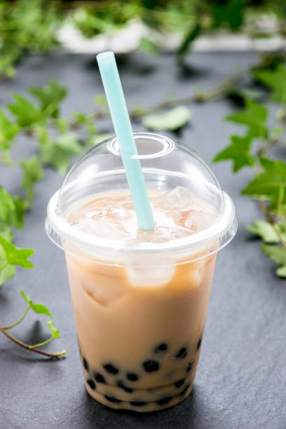 istock Homemade milk bubble tea in plastic cups on table. 893443828