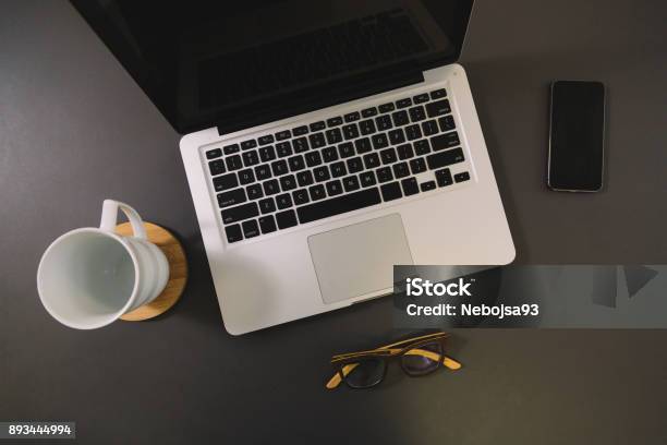 Notebook With Mobile Phone On The Desk Top View Stock Photo - Download Image Now - Above, Blank, Business