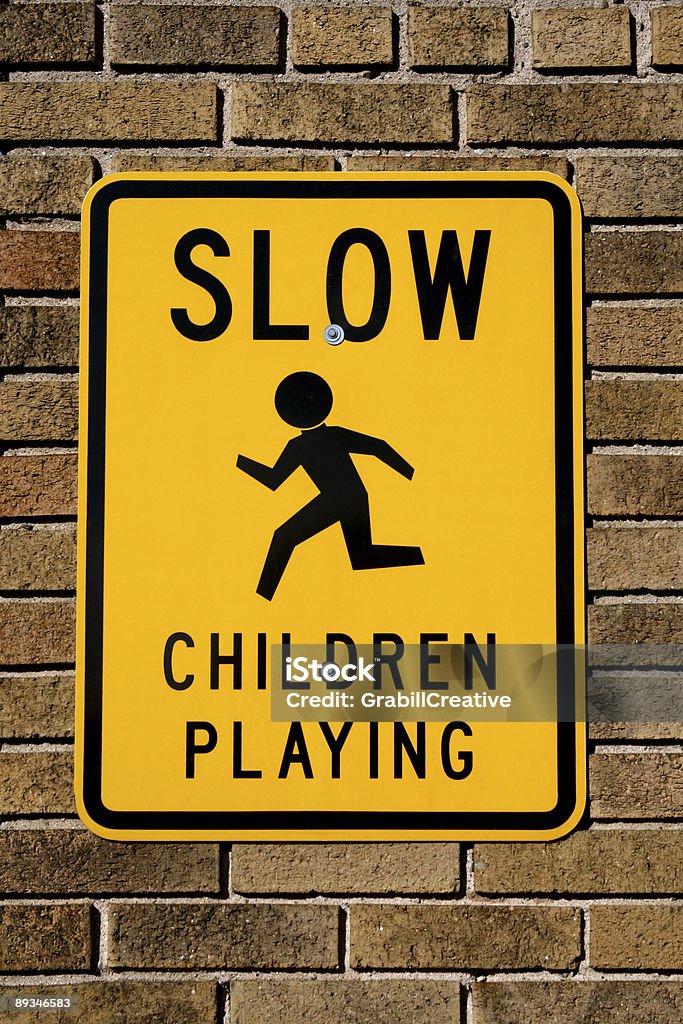 Children Playing Sign on Brick Wall  Brick Stock Photo