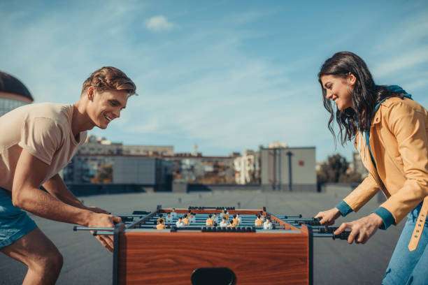 istock couple playing table football 893470010