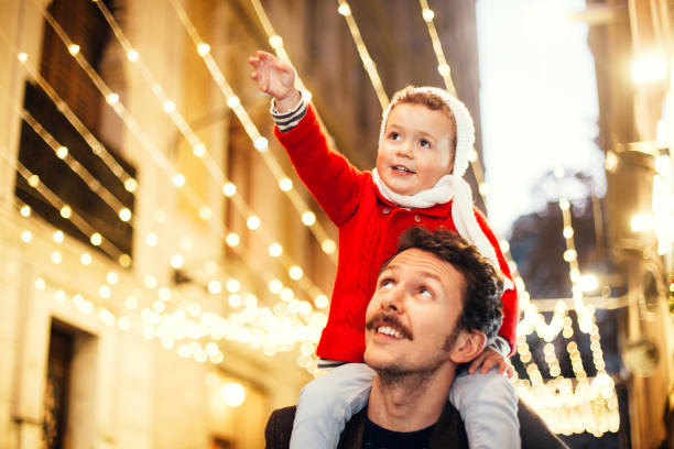 istock Father and son wacthing the Christmas lights 893470036