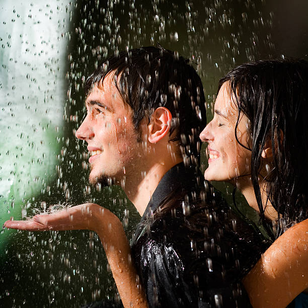 istock Young happy amorous couple hugging under a rain 89347148