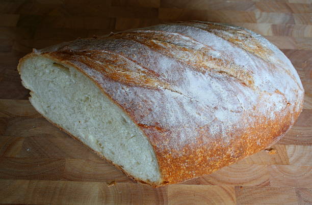 istock Loaf of White Bread on a chopping board 89347237