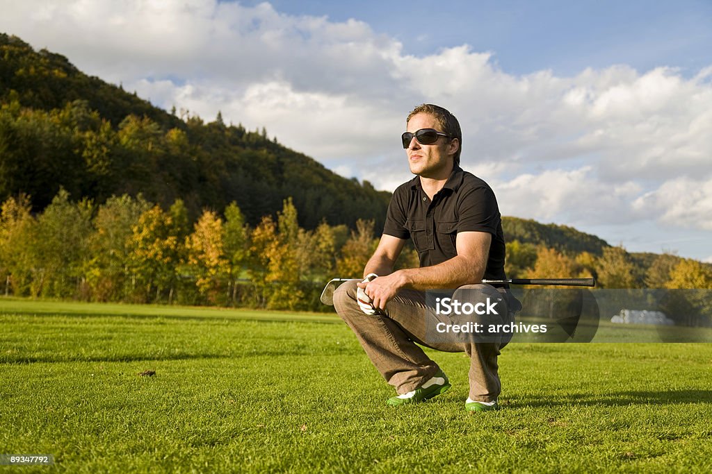 golf player reading the green.  Golf Ball Stock Photo