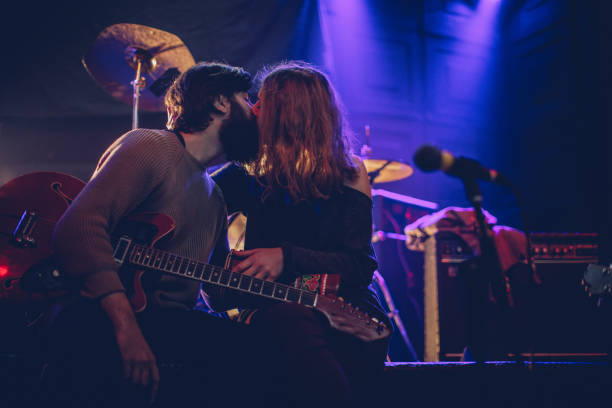 istock Women love guitar players 893478880