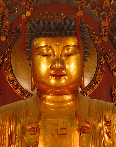 Golden statue of Gautama Buddha stock photo