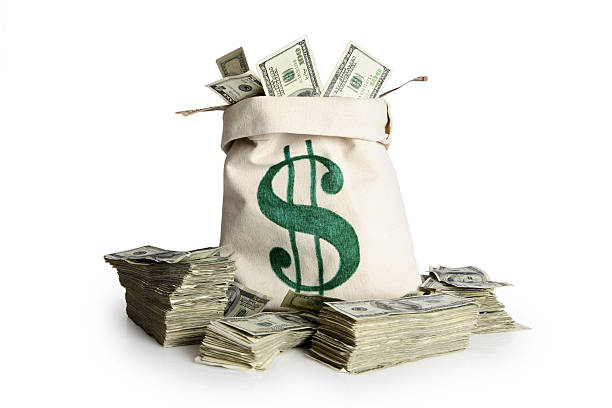 Money bag and stacks of cash  money bag stock pictures, royalty-free photos & images
