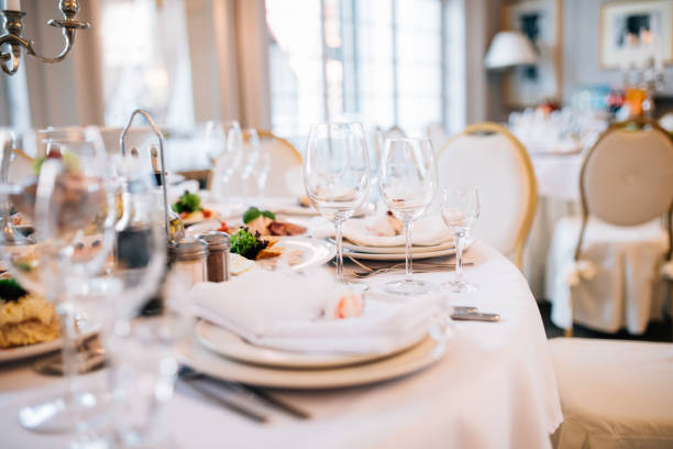 istock Table set for an event party or wedding reception. Served table wedding party 893486420