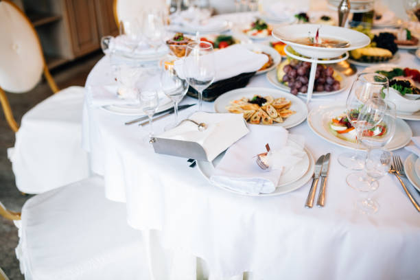 istock Table set for an event party or wedding reception. Served table wedding party 893486522