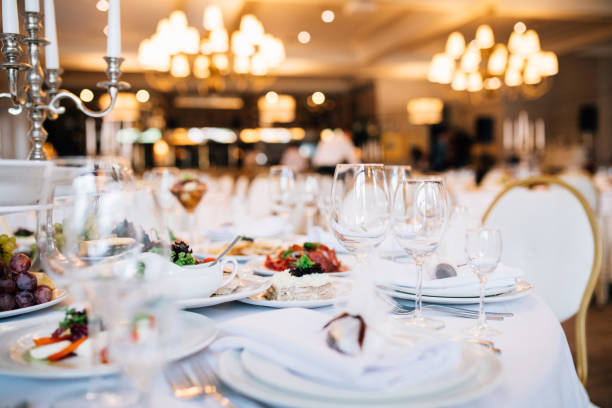 istock Table set for an event party or wedding reception. Served table wedding party 893486576