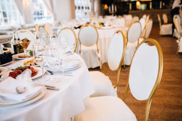 istock wedding table decorated with flowers and serving in the restaurant. Wrdding restaurant 893486610