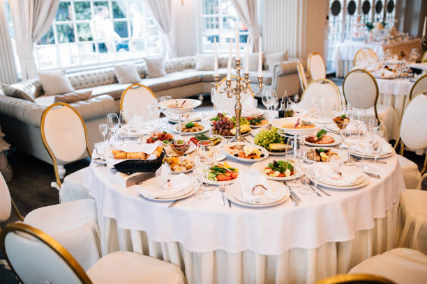 istock wedding table decorated with flowers and serving in the restaurant. Wrdding restaurant 893486704