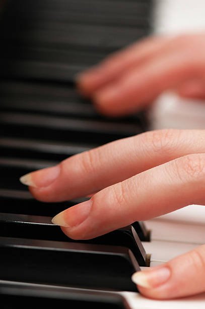 istock Two hands playing music on the  piano 89348873