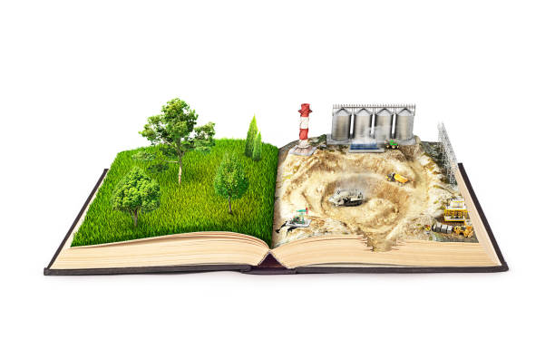 istock open book on one page of nature, on another page with a construction site 893493554