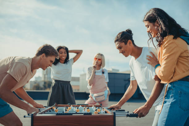 istock friends playing table football 893493844