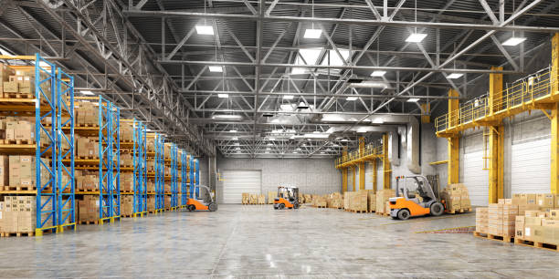 istock Concept of warehouse. The forklift between rows in the big warehouse. 893494016
