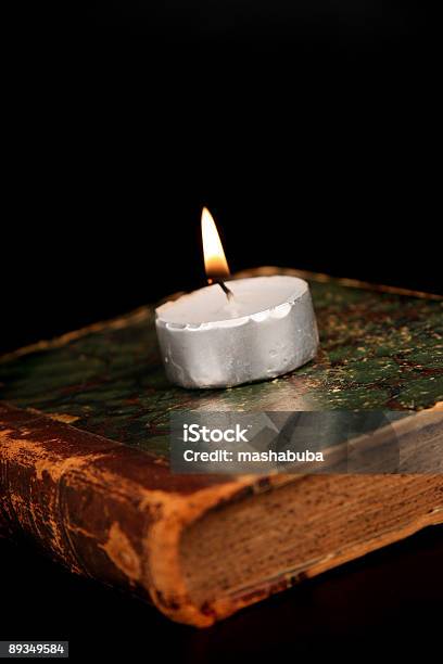 Candle On The Old Book Stock Photo - Download Image Now - Book, Candle, Old