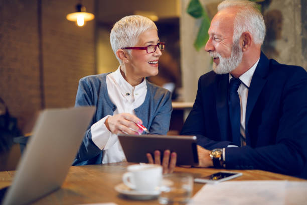 istock Discussing business decisions in a meeting in cafe 893497614
