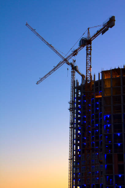 istock tower crane against the blue sky, the process of building a multi-storey building 893500096