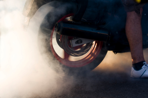 Motorbike burnout on dry asphalt