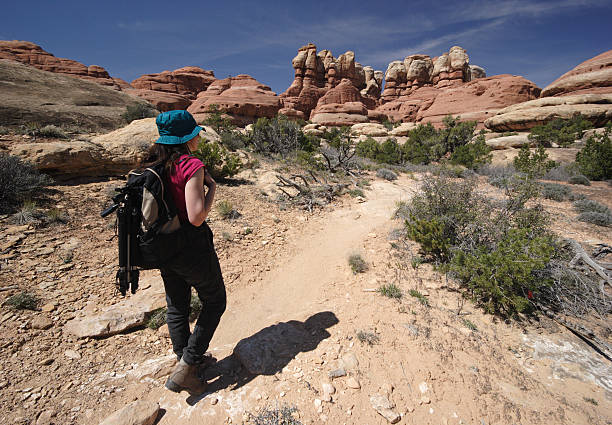 istock Photographer Hiking Down Desert Trail 89350472