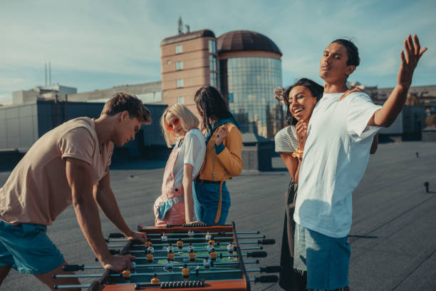 istock friends playing table football 893506014