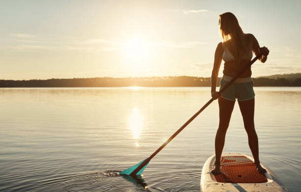 istock The stillness of the water calms her 893508944