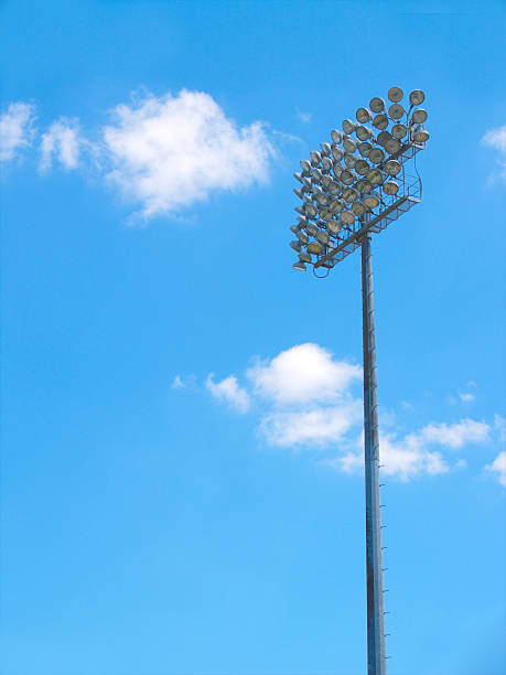 stadion lichter - floodlight blue sky day stock-fotos und bilder