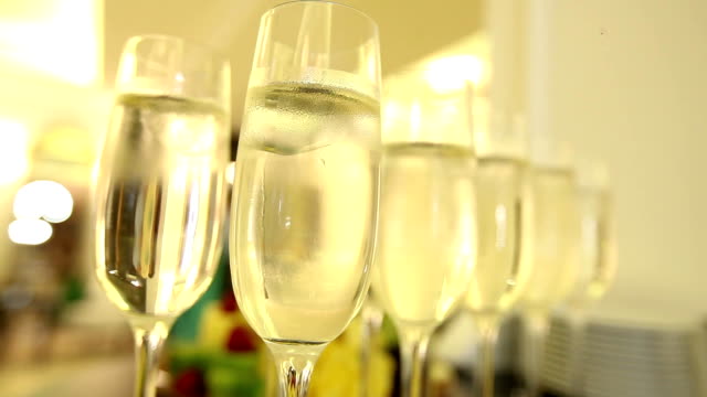 Close up of champagne glasses with celebration new year on the background.