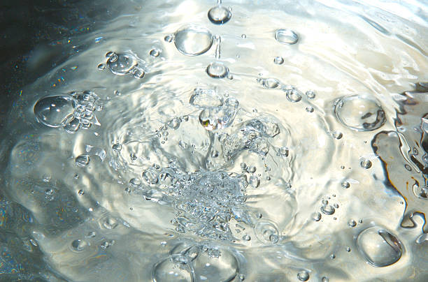 Water drops into sink stock photo