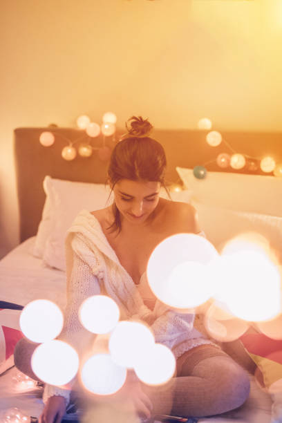 istock Sensual woman reading in bedroom 893517008