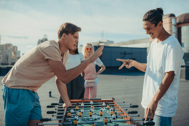 istock men playing rock-paper-scissors 893521256