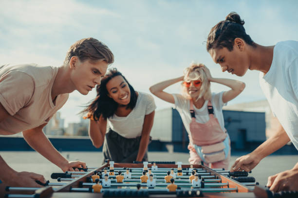 istock men playing table football 893521726