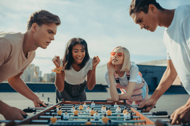 istock men playing table football 893521798