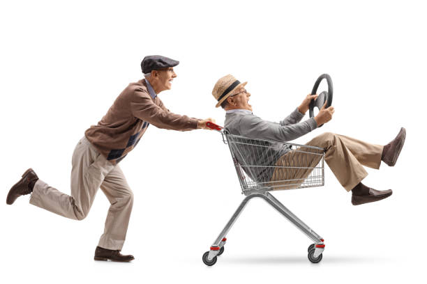 istock Senior pushing a shopping cart with another senior with a steering wheel riding inside 893522726