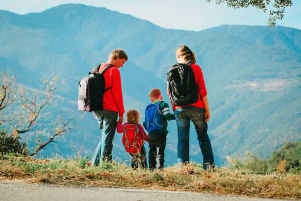 istock family with two kids hiking in mountains 893537310