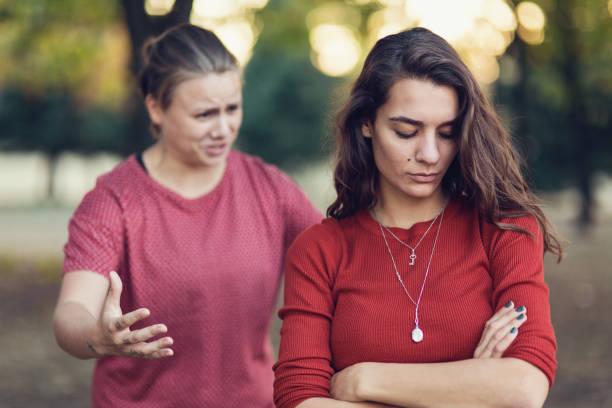 istock Young women arguing in the park. 893537654