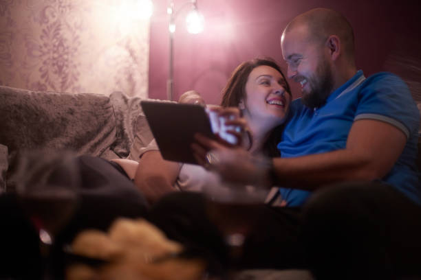 istock Young couple relaxing at home 893543790