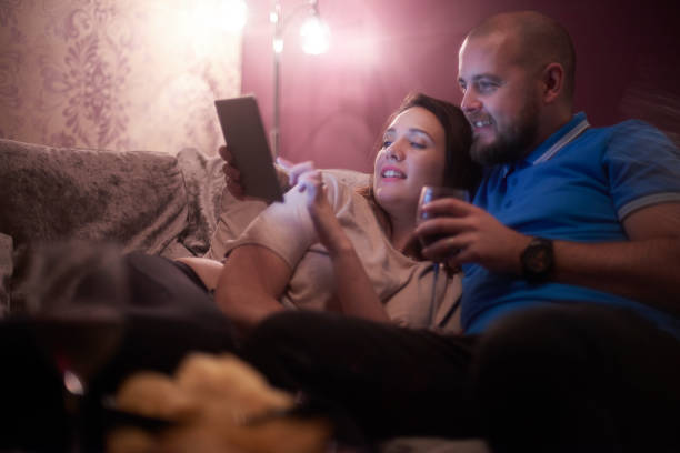 istock Young couple looking at social media 893544012