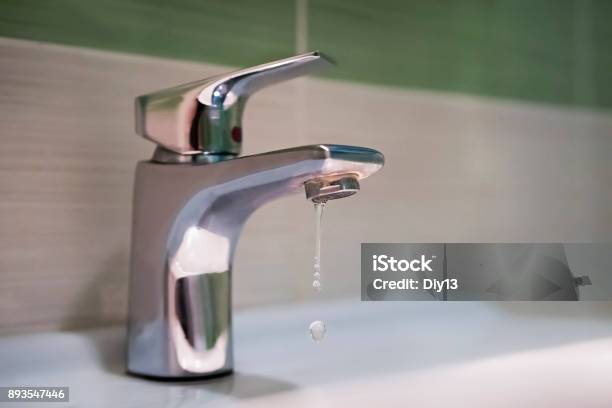 Traditional Silver Tap Dripping Stock Photo - Download Image Now - Faucet, Drop, Leaking