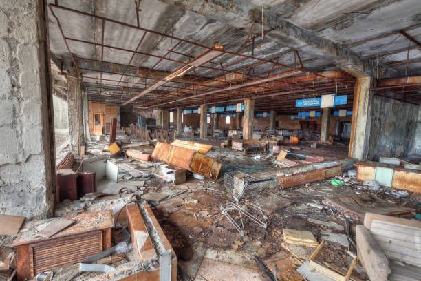 istock Ruined supermarket in overgrown ghost city Pripyat. 893555814
