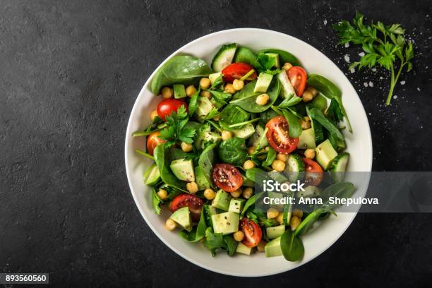 Avocado Tomato Chickpeas Spinach And Cucumber Salad Stock Photo - Download Image Now