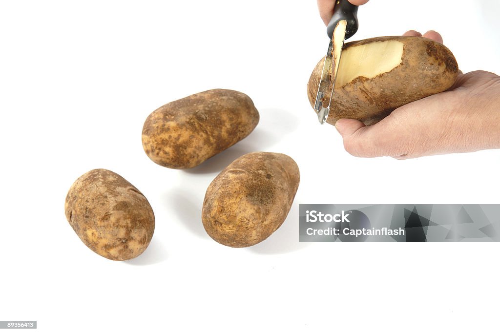Éplucher de pommes de terre - Photo de Agriculture libre de droits