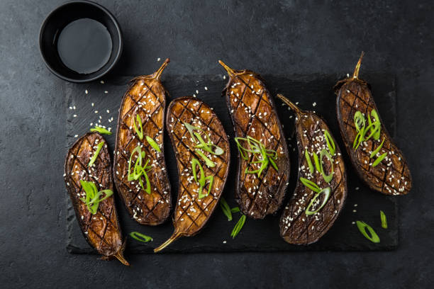 istock glazed grilled eggplants served with sesame seeds and green onion 893568166