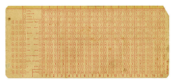 A grungy stained 1970's era computer punch card isolated on white.