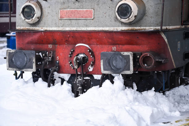 Old train locomotive stuck in train station after heavy snowfall